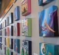 Picture shows canvases from a previous Four Eights exhibit show on the gallery walls. 