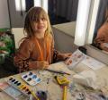 A child painting a notebook
