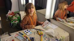 A child painting a notebook