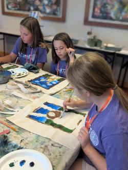 Kids painting a painting